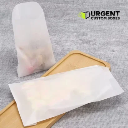 Eco-friendly semi-transparent glassine greaseproof food bags on a wooden serving tray