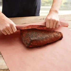 Wrapping a smoked beef brisket in unprinted brown kraft butcher paper