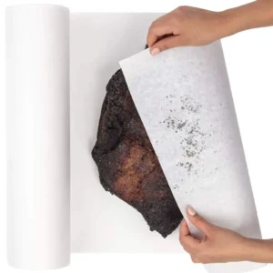 Wrapping a smoked beef brisket using a roll of premium white butcher paper