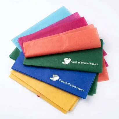 Fanned stack of colored tissue paper in solid shades with white-ink logo printing